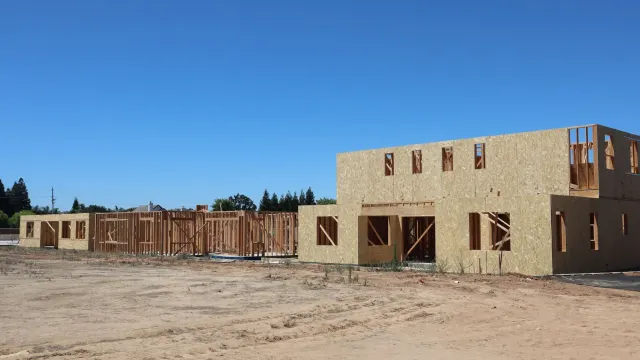 Framing of new residential buildings under construction in Elk Grove, California.